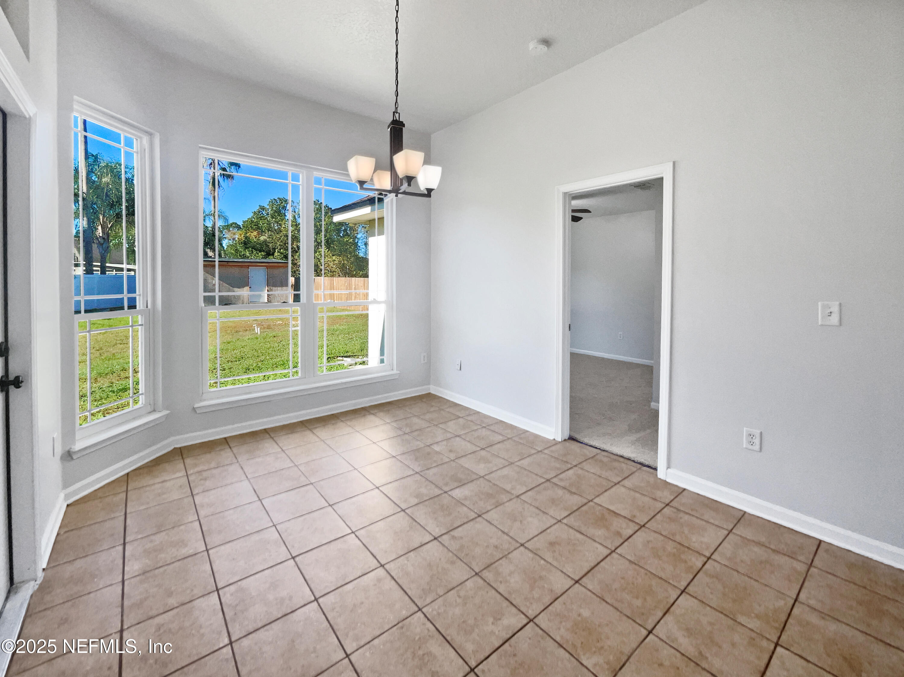 9767 Brockham Court Jacksonville, FL 32221 - Photo 5 of 17 a view of livingroom with chandelier