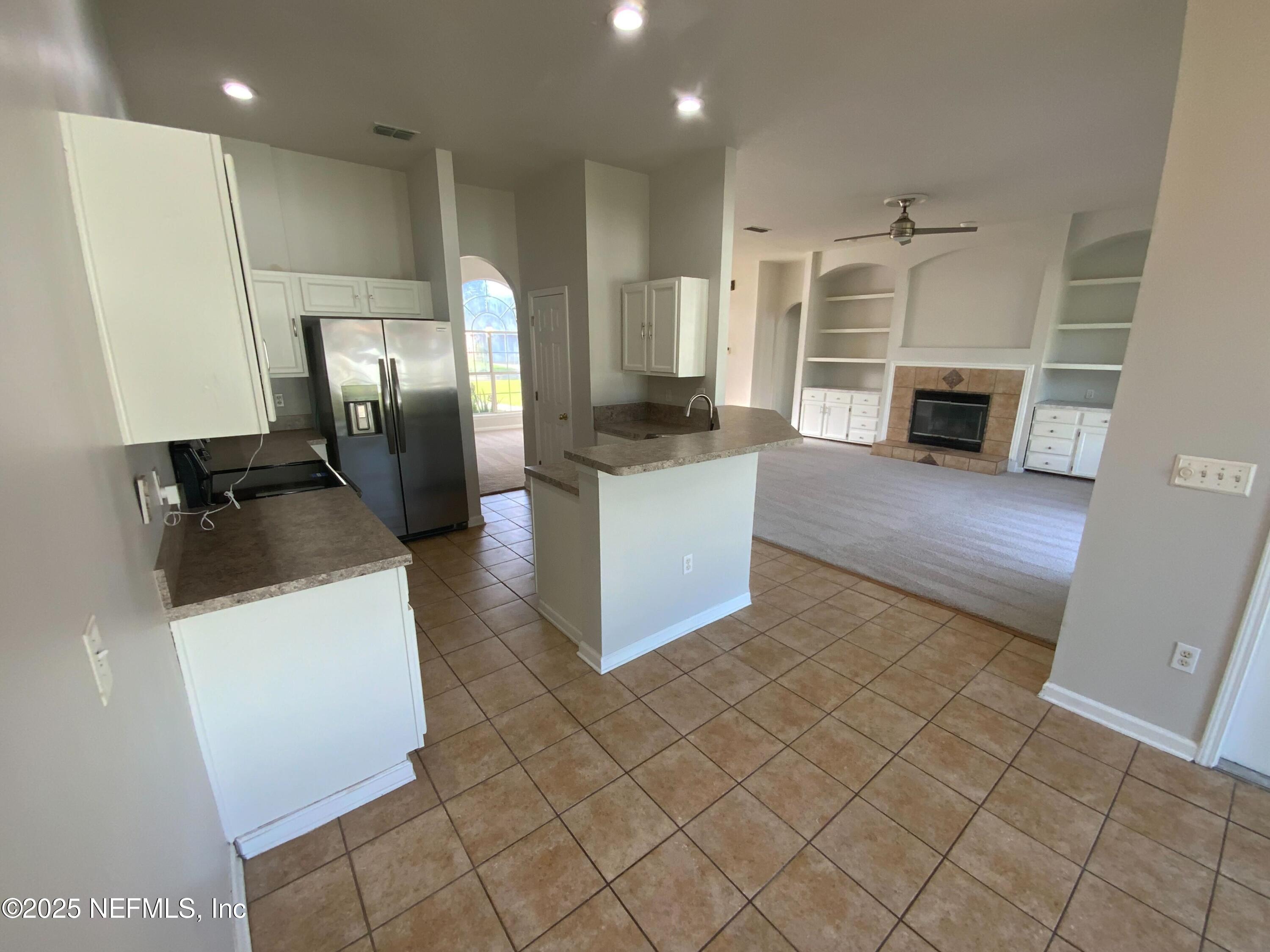 9767 Brockham Court Jacksonville, FL 32221 - Photo 10 of 17 a kitchen with stainless steel appliances granite countertop a refrigerator a oven and a sink