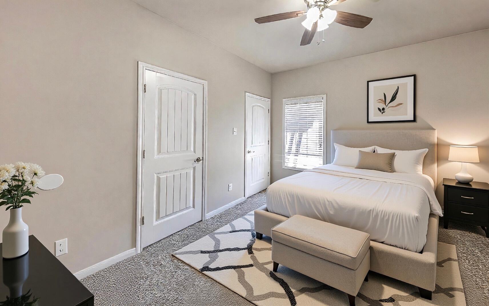 1 Highland Drive Ransom Canyon, TX 79366 - Photo 17 of 27 a bedroom with a large bed and a chandelier