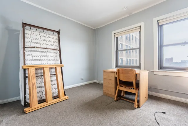 a view of workspace with furniture and windows
