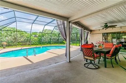 a view of a dining room with furniture and garden
