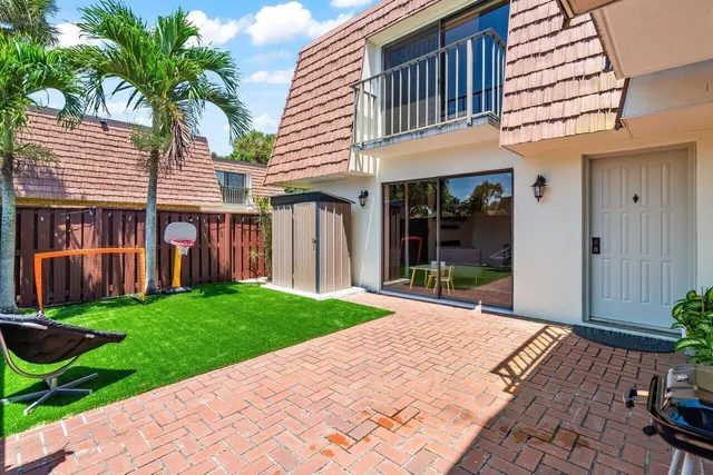 a front view of a house with a yard and porch