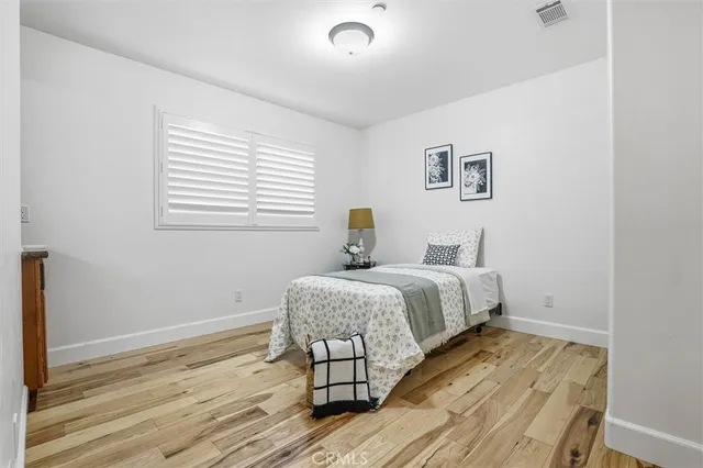 a bedroom with a bed and a rug