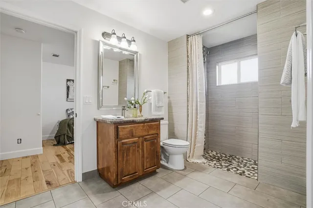 a bedroom with a bed and a mirror