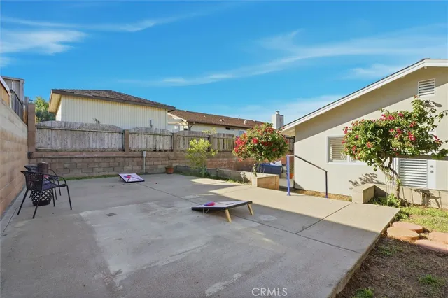 a view of a patio with couches and potted plants