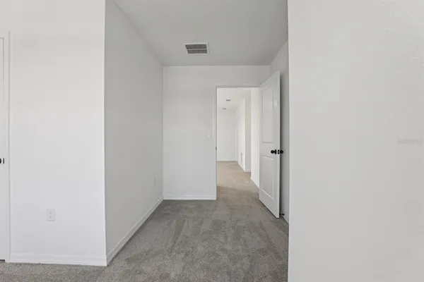 a view of a hallway with closet