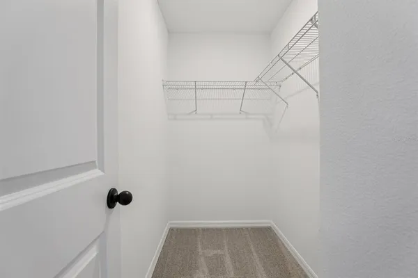 a view of a room with racks on the wall