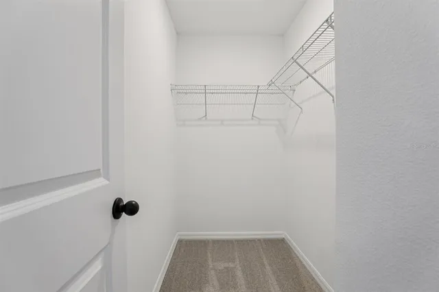 a view of a room with racks on the wall