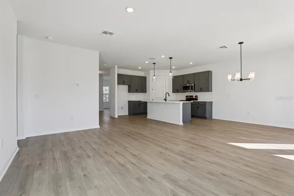 a view of a kitchen with a sink and a microwave