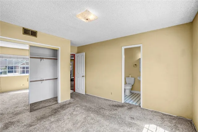 a view of a room with a refrigerator