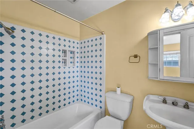 a bathroom with a bathtub and sink