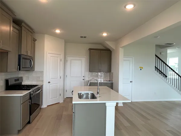 a play room with table and a potted plant