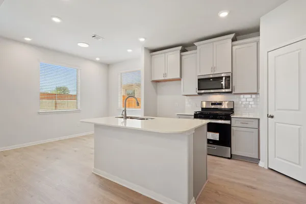 a picture of a wall with a white building