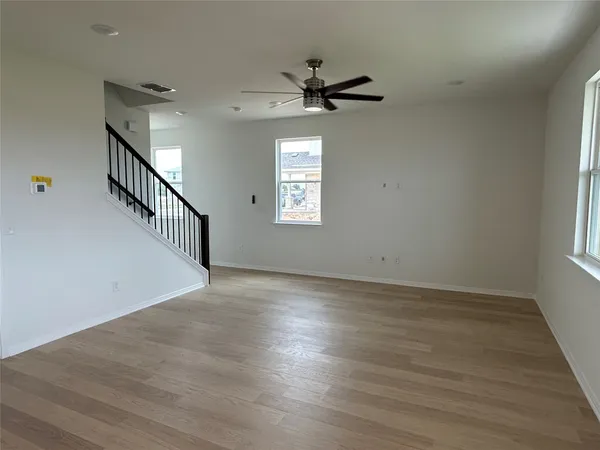 a kitchen with a sink a microwave and cabinets