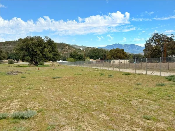 a view of a lake with a yard