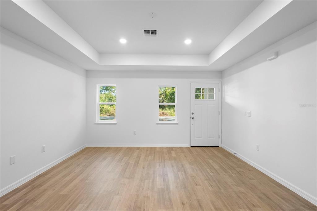 2264 Suanee Eustis, FL 32726 - Photo 15 of 37 an empty room with wooden floor and windows