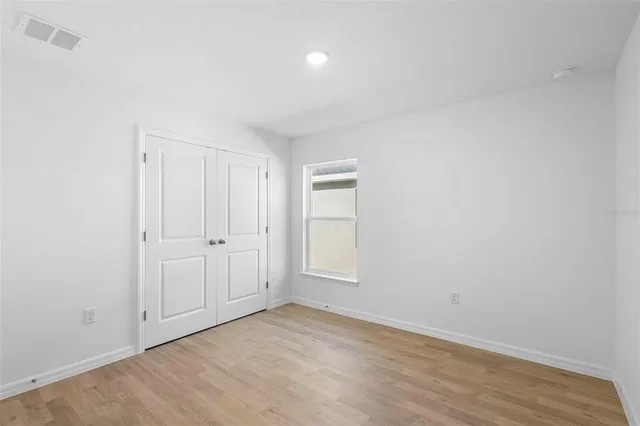 a view of an empty room and window