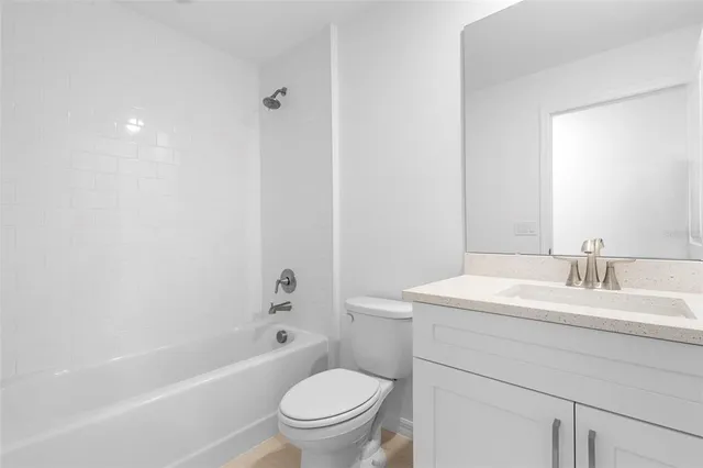 a bathroom with a sink a toilet and a bathtub