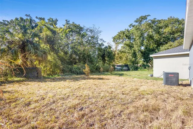 a view of a yard with an trees