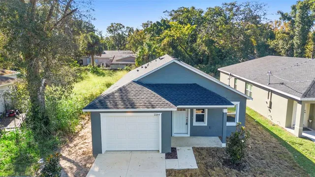 a house that has tree in front of it