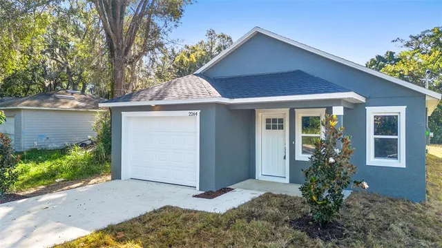 front view of a house with a small yard