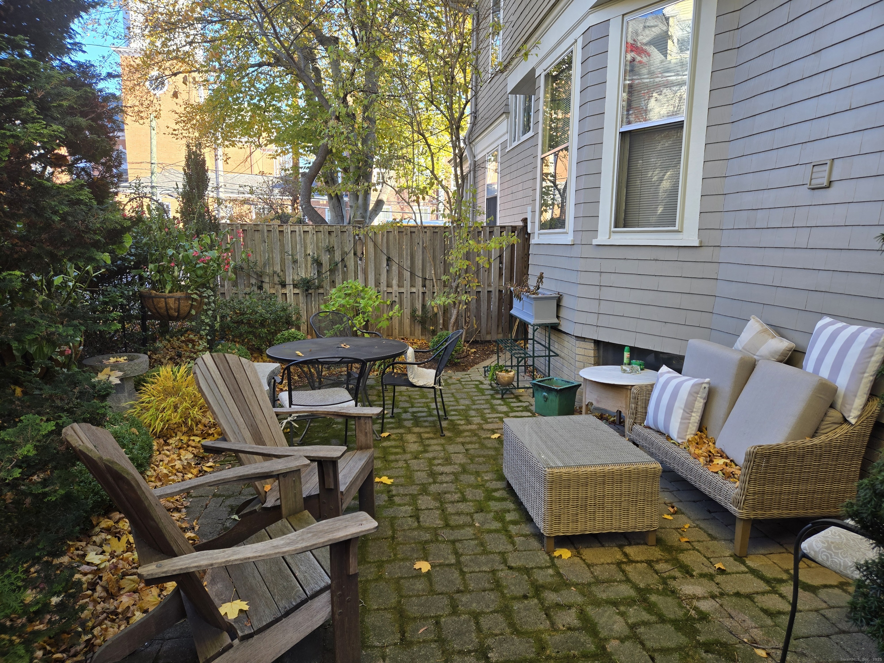 188 Cold Spring Street, Unit 4 New Haven, CT 06511 - Photo 15 of 18 a view of a patio with couches chairs and a fire pit