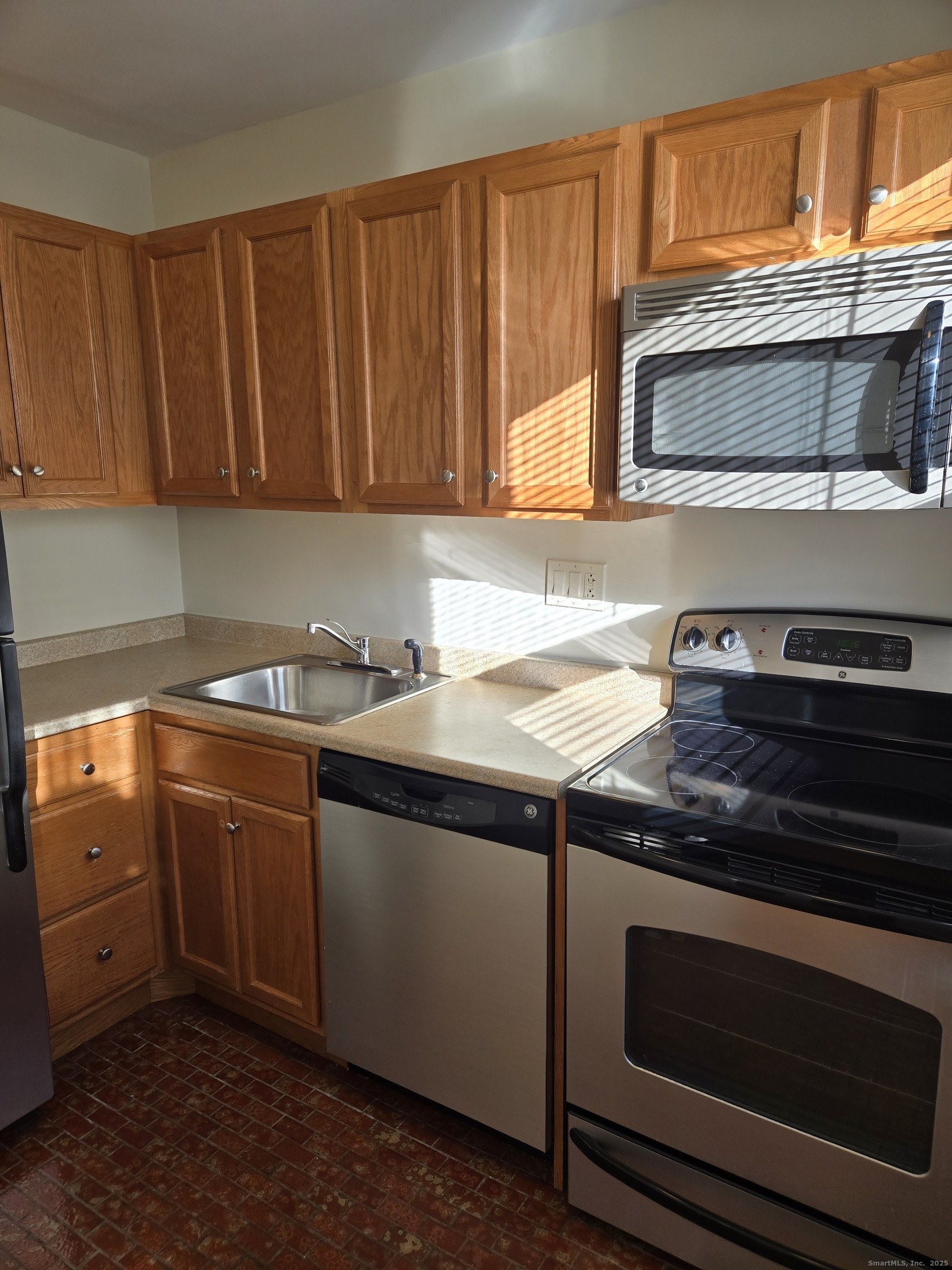 188 Cold Spring Street, Unit 4 New Haven, CT 06511 - Photo 7 of 18 a kitchen with granite countertop wood cabinets stainless steel appliances and a sink