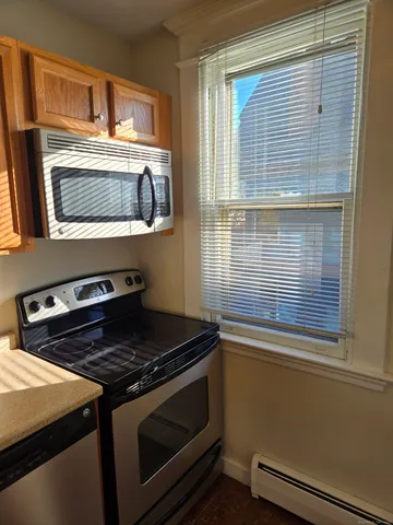 a kitchen with a stove and a microwave