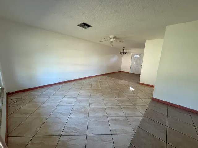 a view of a room with a utility room and empty racks