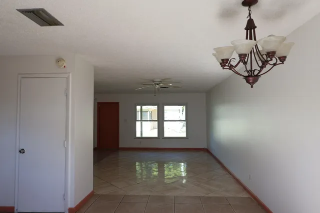 a view of a windows and a chandelier in a room