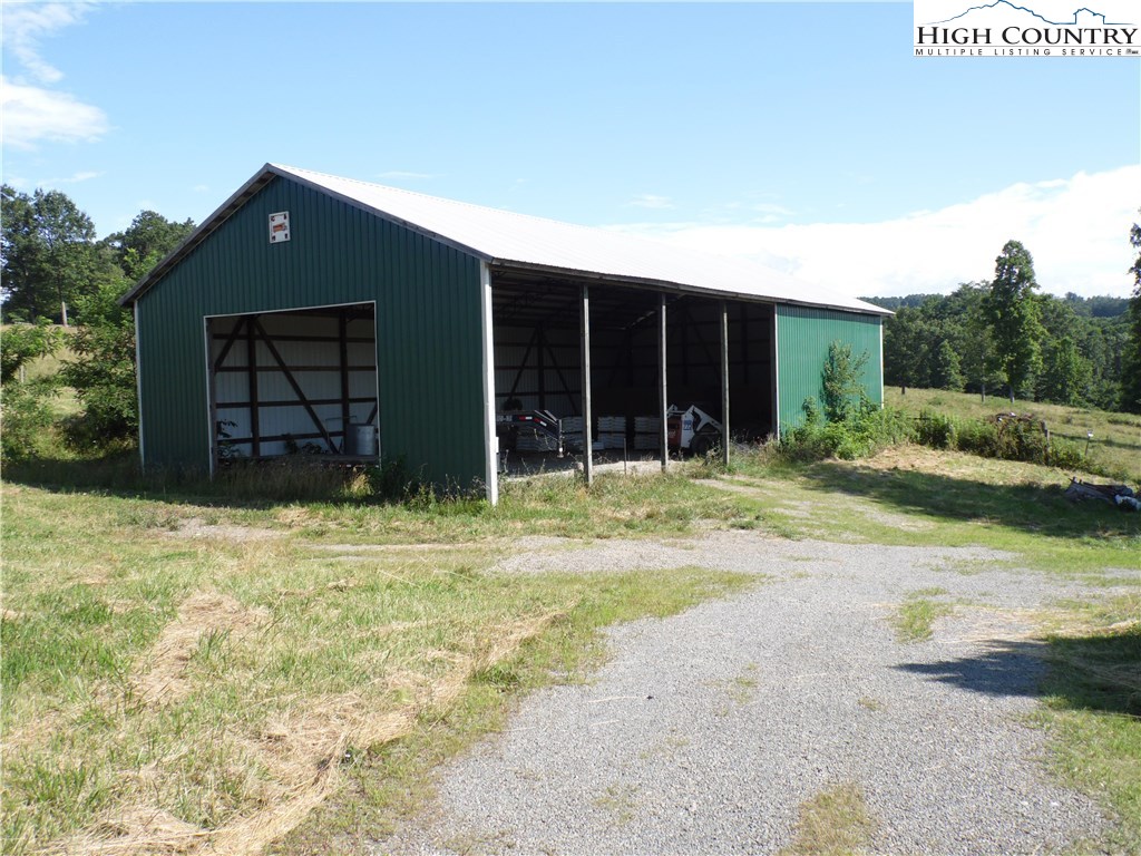 1032 Wagoner Ridge Road Ennice, NC 28623 - Photo 5 of 23 a front view of a house with a yard