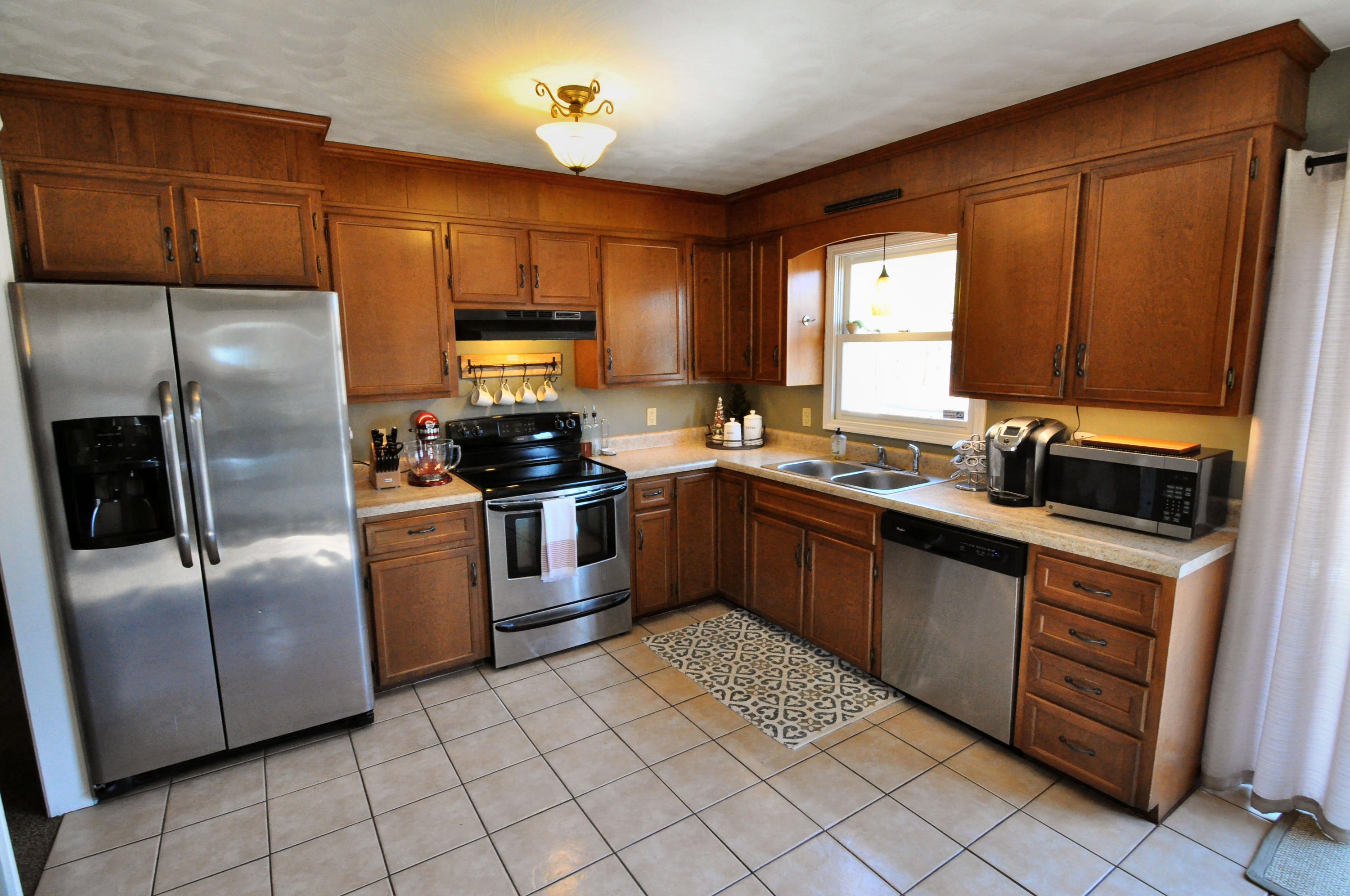 2750 Sandy Level Road Goodview, VA 24095 - Photo 13 of 20 a kitchen with stainless steel appliances granite countertop a refrigerator sink and stove