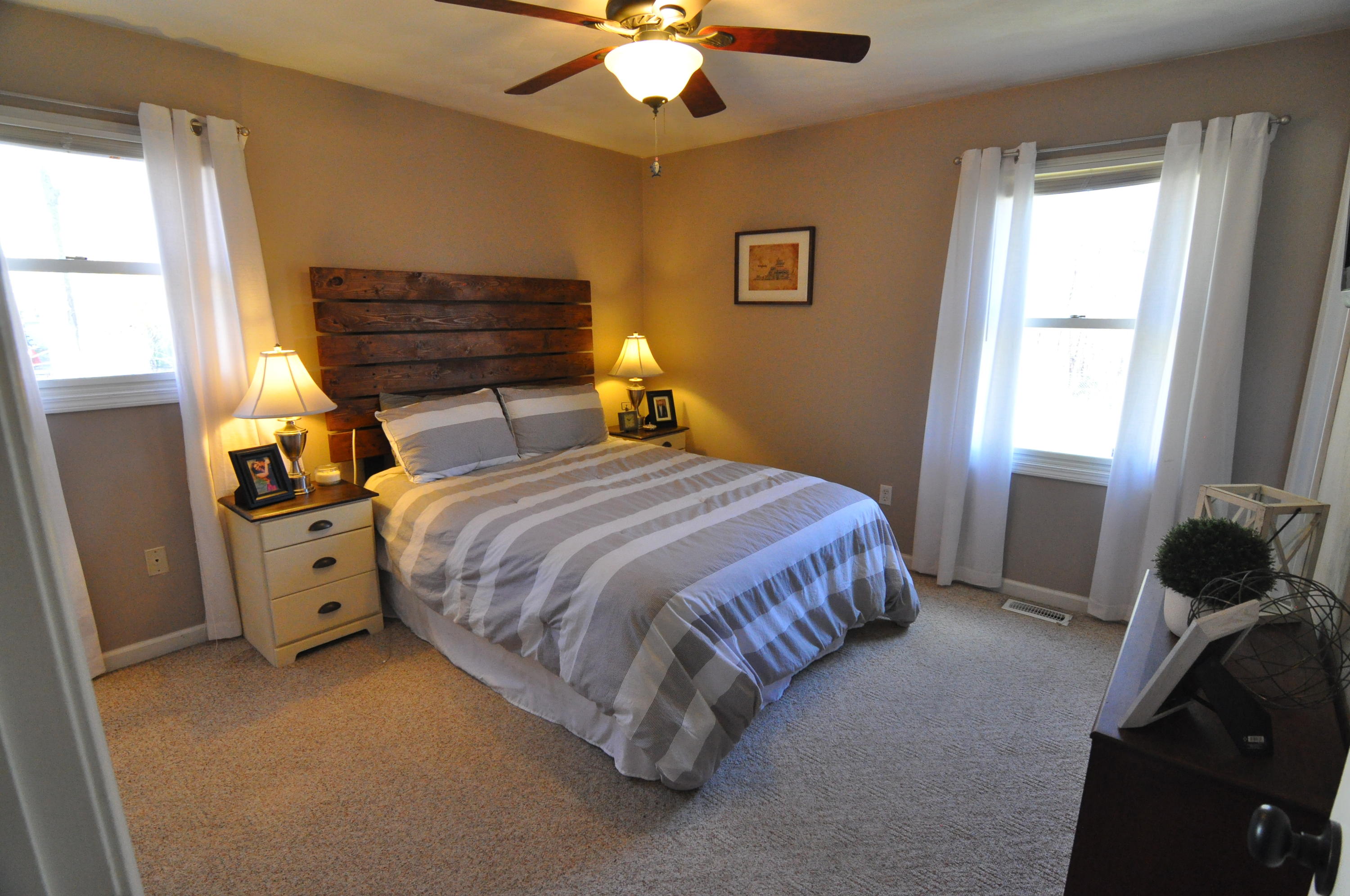 2750 Sandy Level Road Goodview, VA 24095 - Photo 19 of 20 a bedroom with a bed and a chandelier
