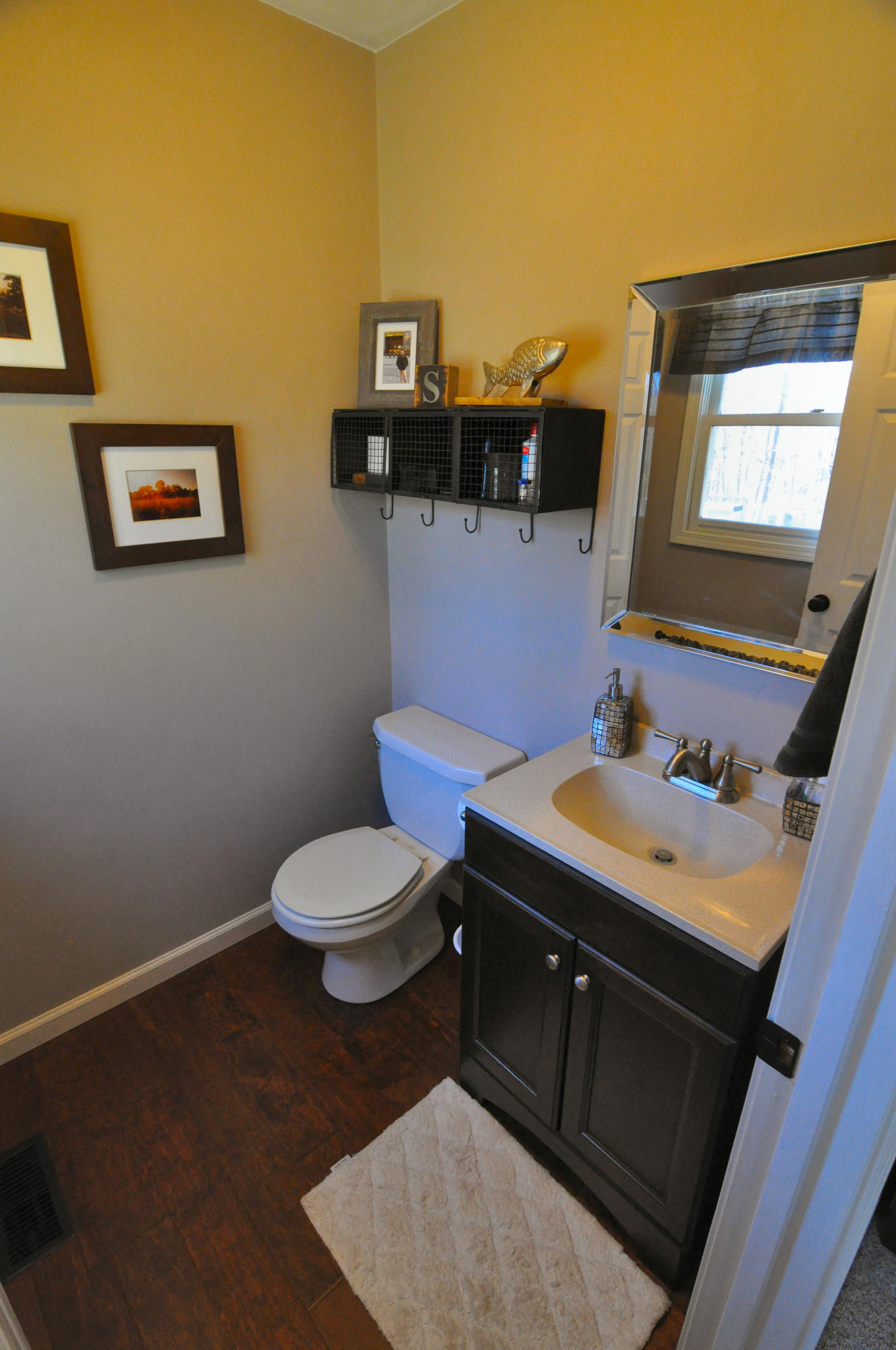 2750 Sandy Level Road Goodview, VA 24095 - Photo 20 of 20 a bathroom with a sink mirror and toilet
