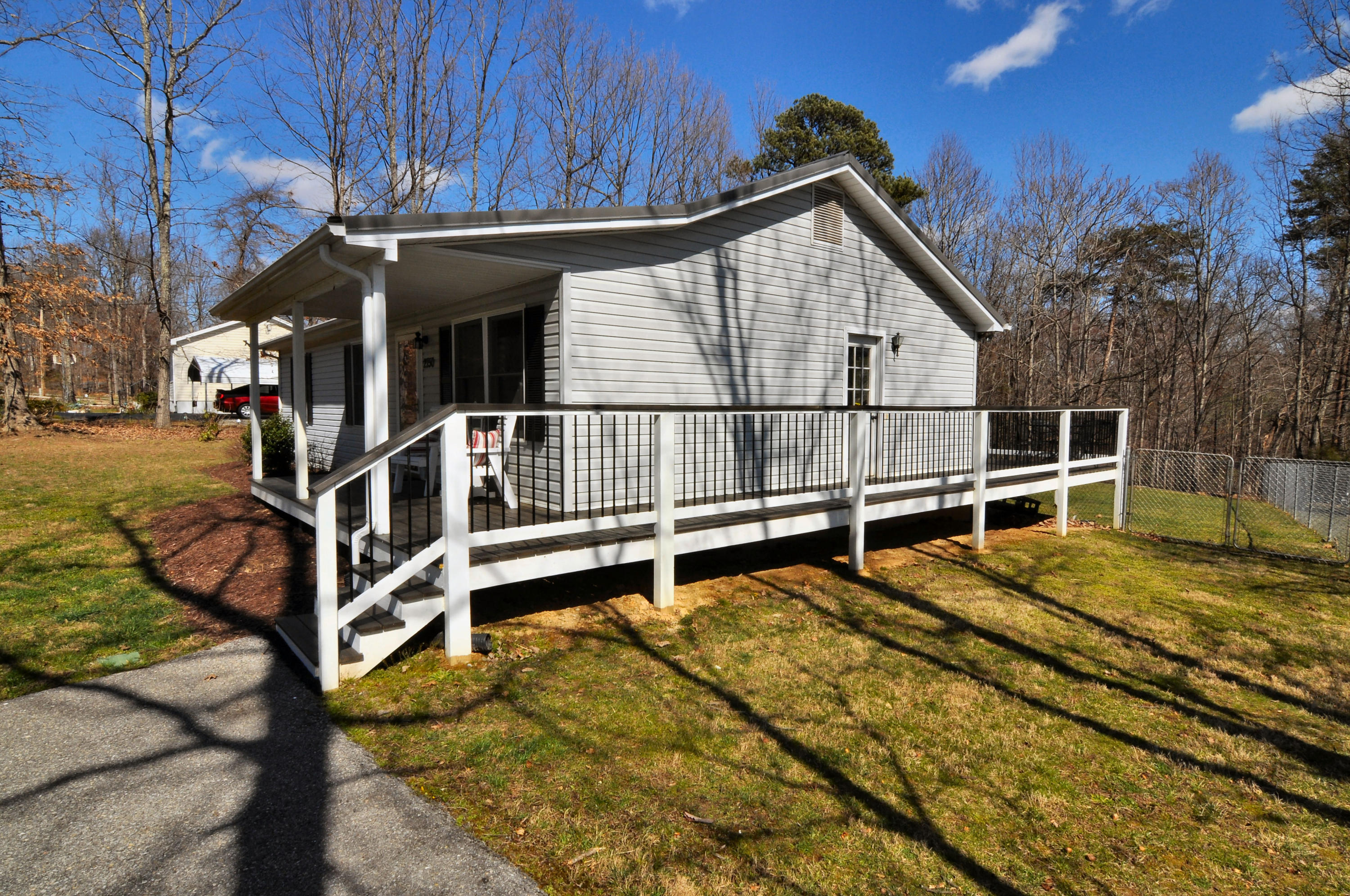 2750 Sandy Level Road Goodview, VA 24095 - Photo 5 of 20 a view of house with backyard and trees
