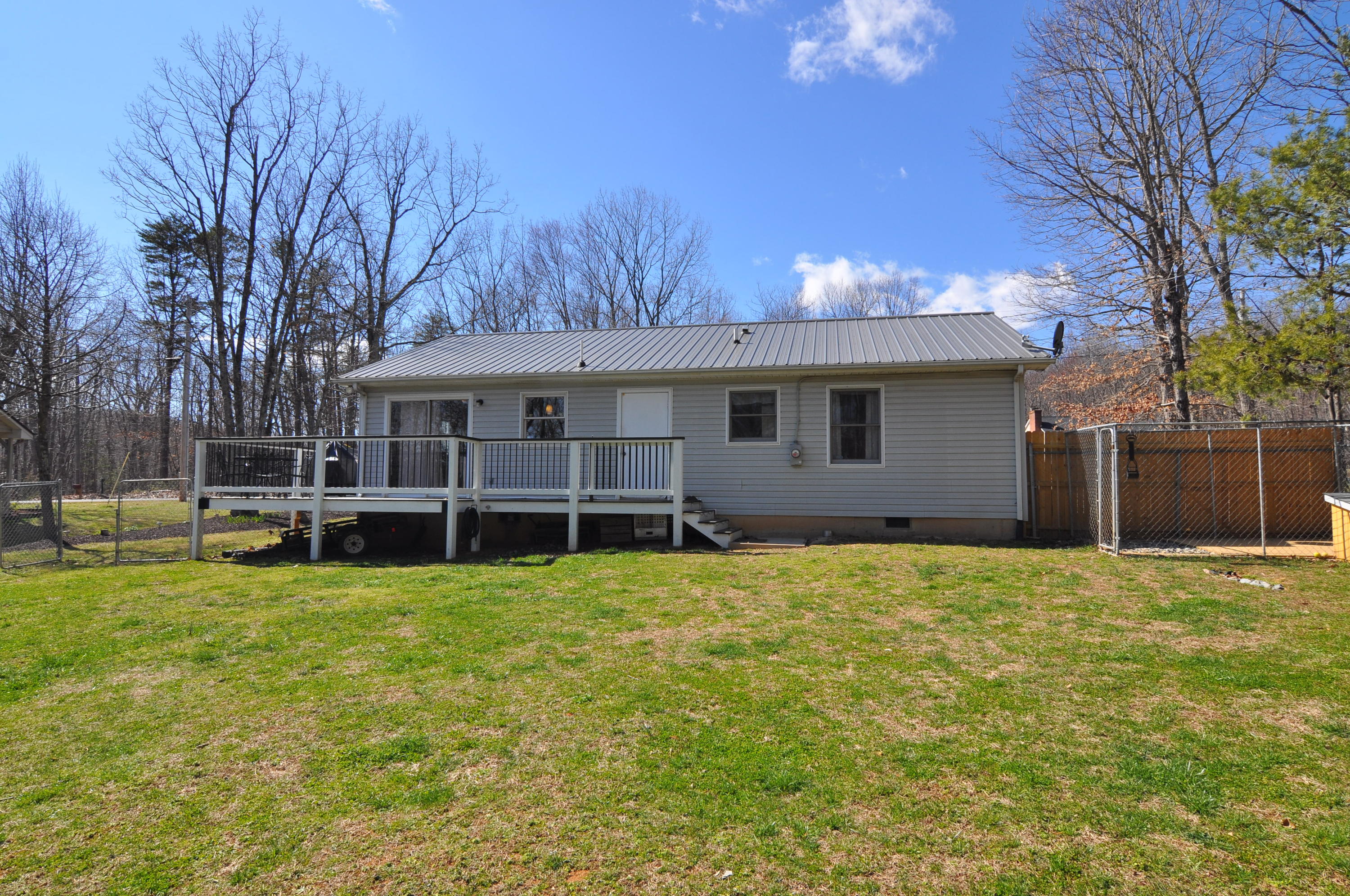 2750 Sandy Level Road Goodview, VA 24095 - Photo 8 of 20 a view of a house with a yard