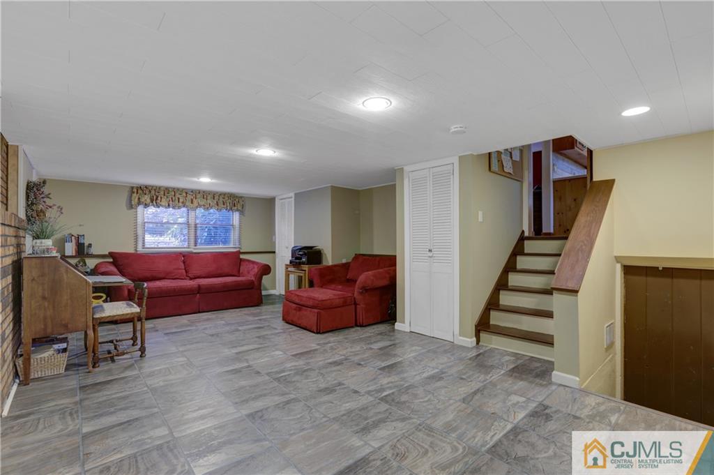 73 Ramsey Road Middlesex, NJ 08846 - Photo 17 of 25 a living room with furniture and stairs