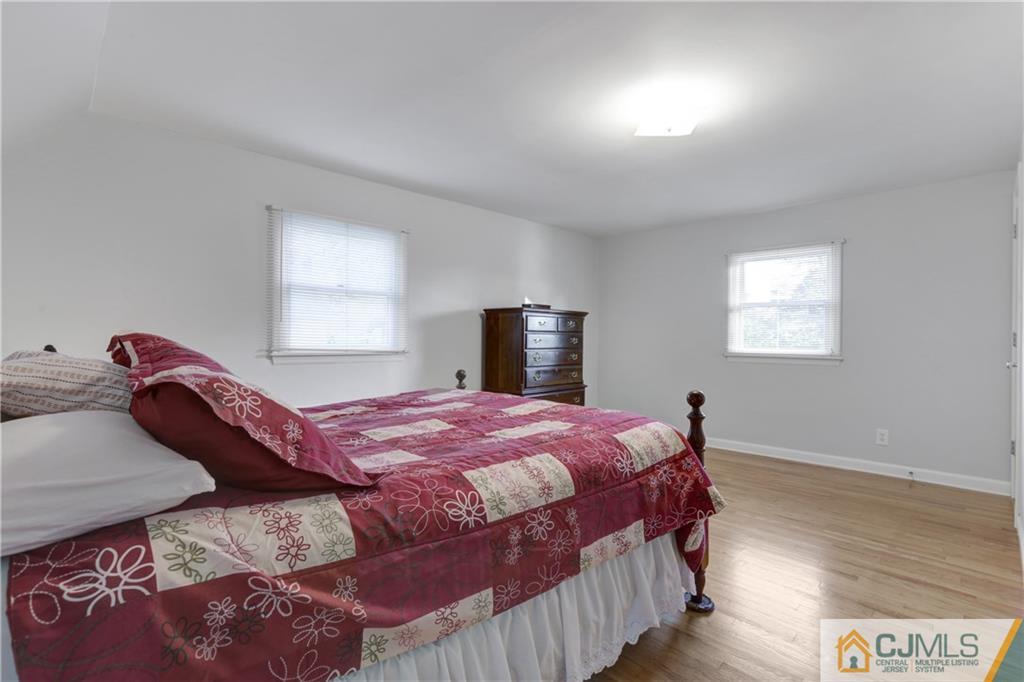 73 Ramsey Road Middlesex, NJ 08846 - Photo 19 of 25 a bedroom with a bed and wooden floor
