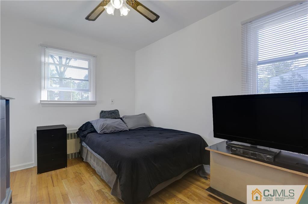 73 Ramsey Road Middlesex, NJ 08846 - Photo 23 of 25 a bedroom with a bed and a flat screen tv