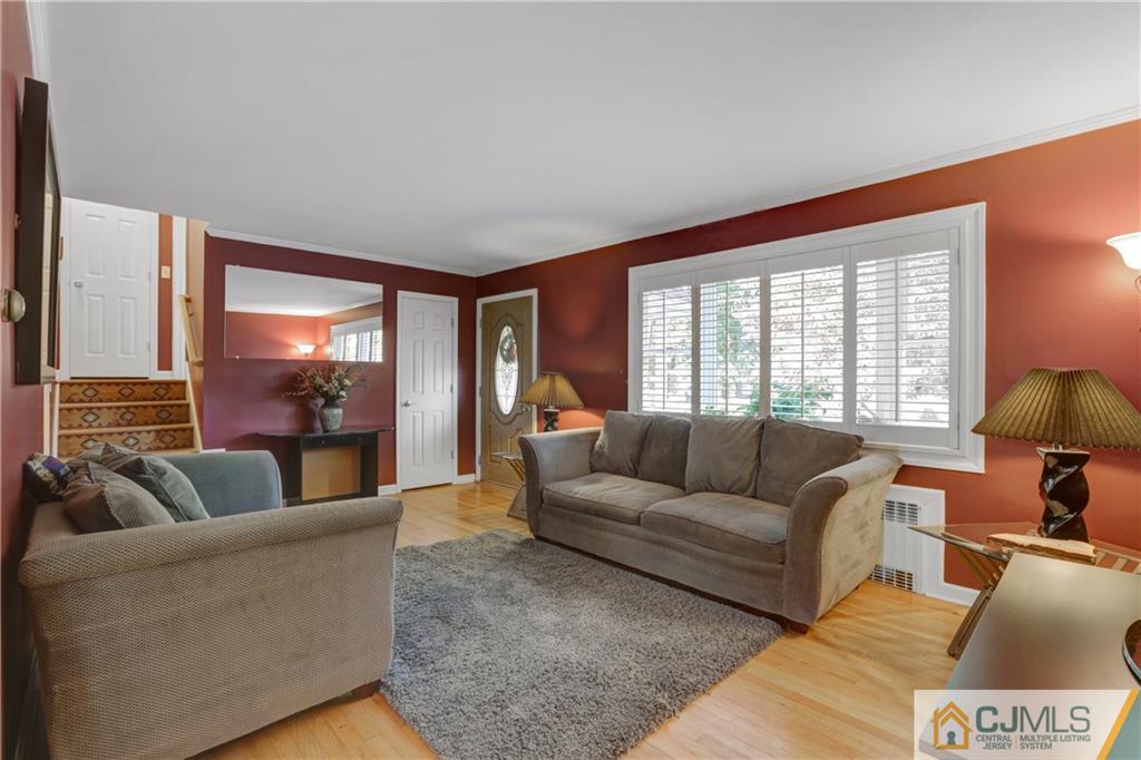 73 Ramsey Road Middlesex, NJ 08846 - Photo 7 of 25 a living room with furniture and a large window