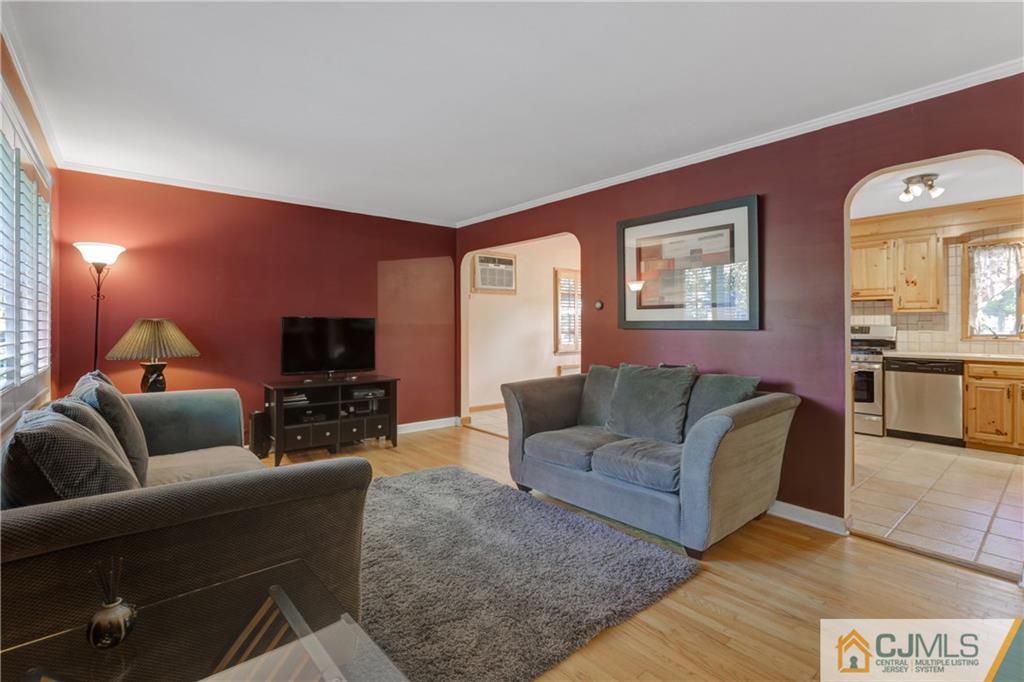 73 Ramsey Road Middlesex, NJ 08846 - Photo 8 of 25 a living room with furniture and a flat screen tv