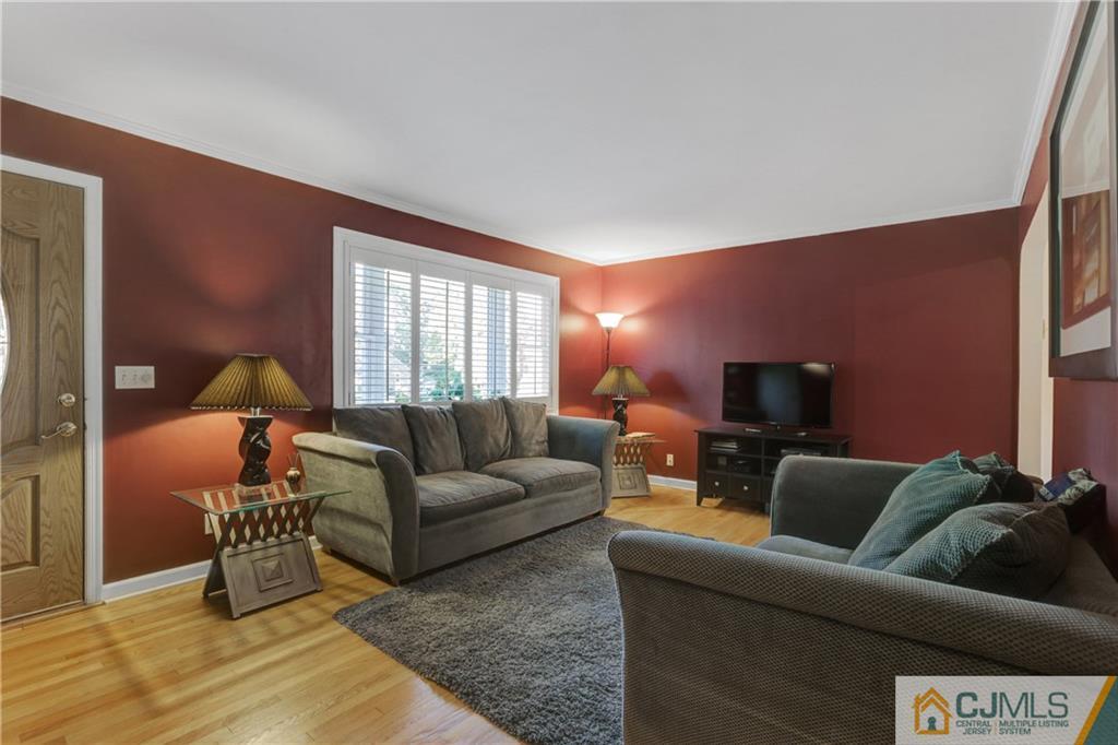 73 Ramsey Road Middlesex, NJ 08846 - Photo 9 of 25 a living room with furniture and a flat screen tv