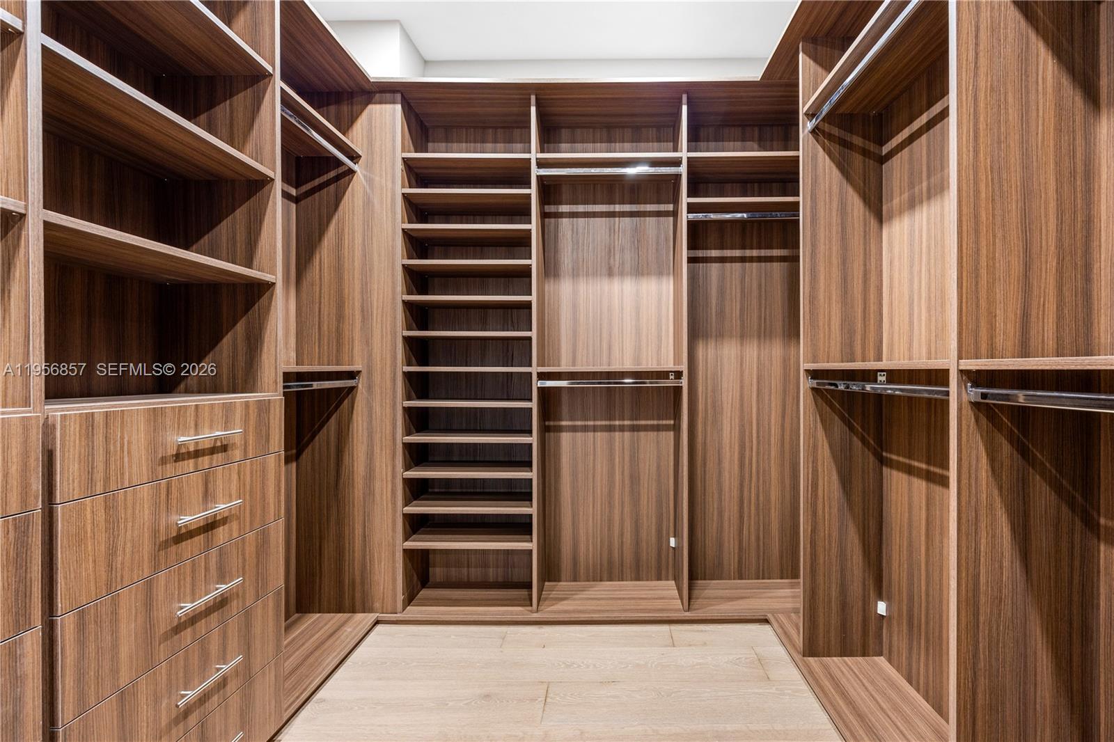 2805 Freeman Street Miami, FL 33133 - Photo 27 of 70 a view of walk in closet with clothes and shoes