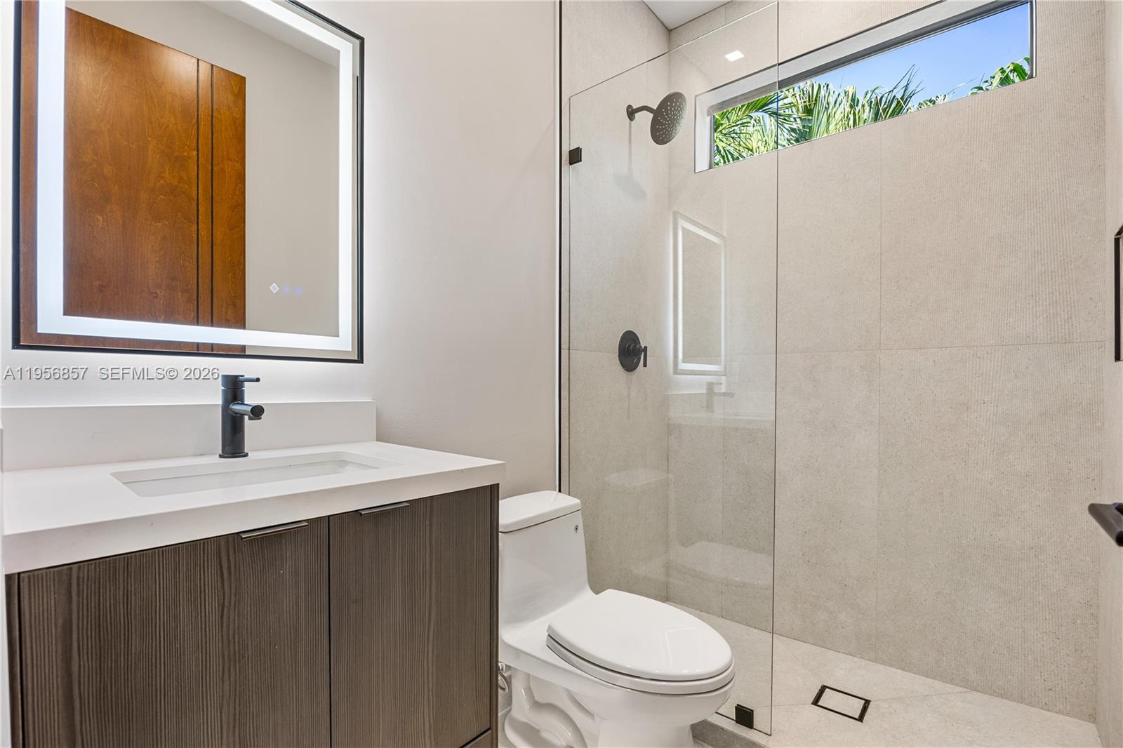 2805 Freeman Street Miami, FL 33133 - Photo 36 of 92 a bathroom with a sink a toilet and shower