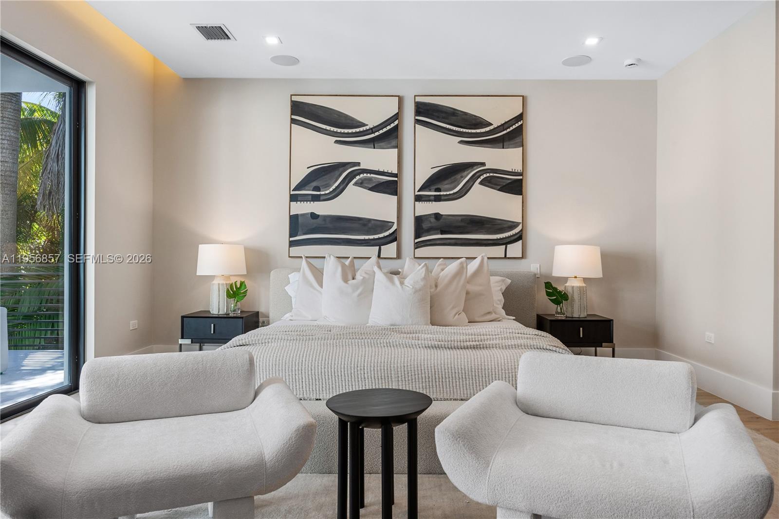 2805 Freeman Street Miami, FL 33133 - Photo 63 of 92 a bedroom with a bed and wooden floor