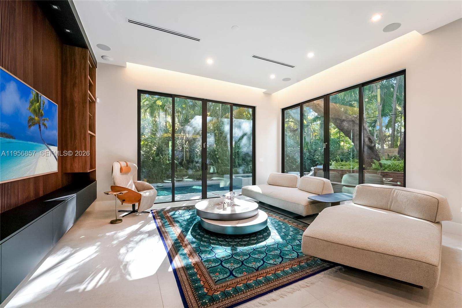 2805 Freeman Street Miami, FL 33133 - Photo 7 of 70 a living room with patio furniture and a flat screen tv