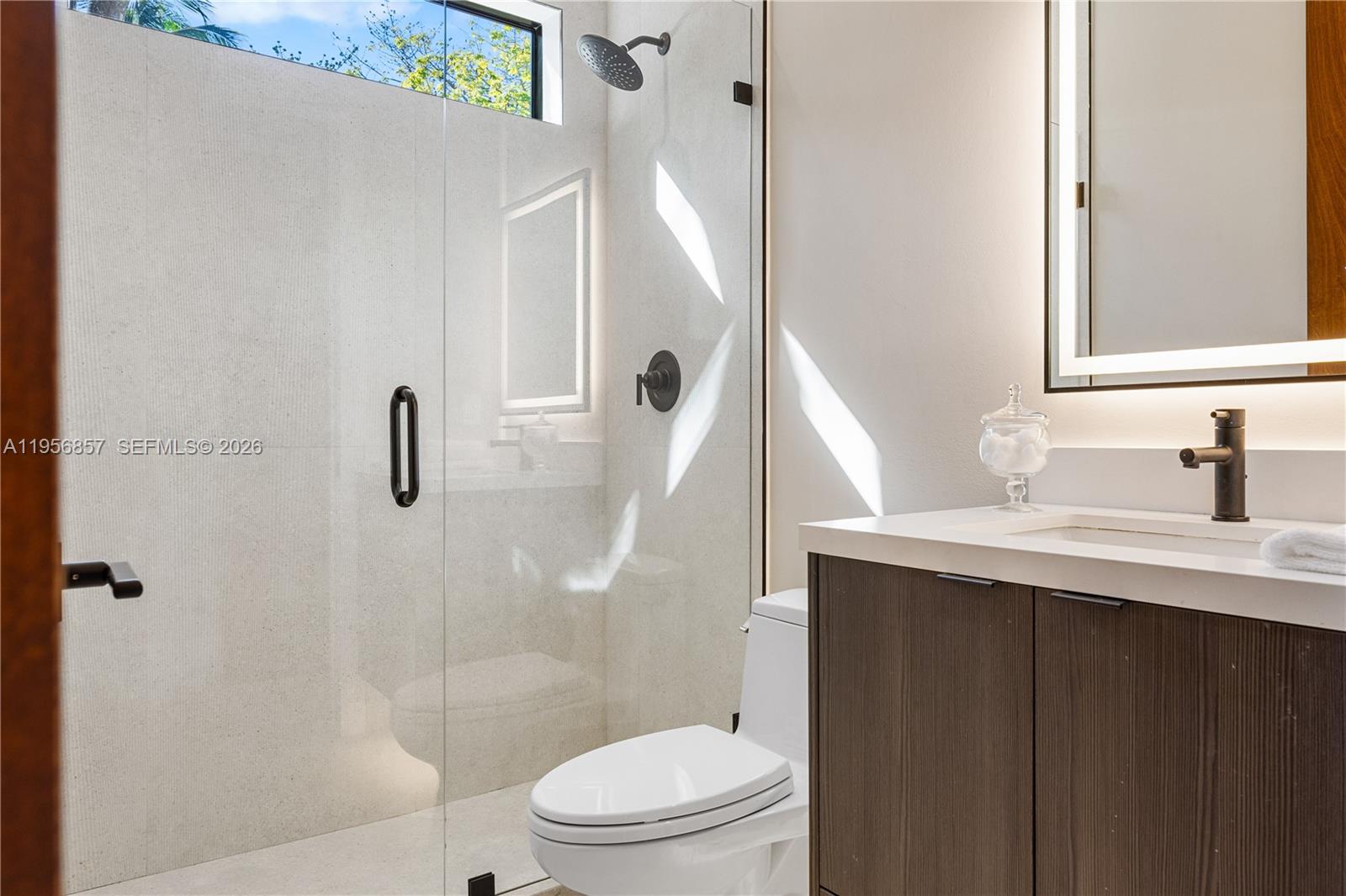 2805 Freeman Street Miami, FL 33133 - Photo 72 of 92 a bathroom with a sink a toilet and shower