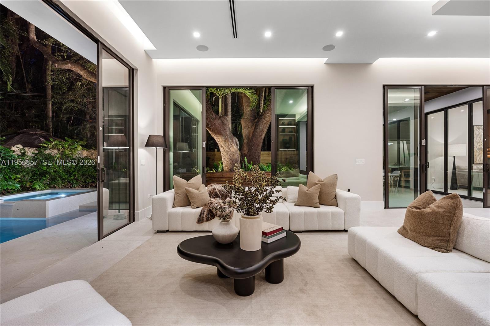 2805 Freeman Street Miami, FL 33133 - Photo 77 of 92 a living room with furniture and a large window