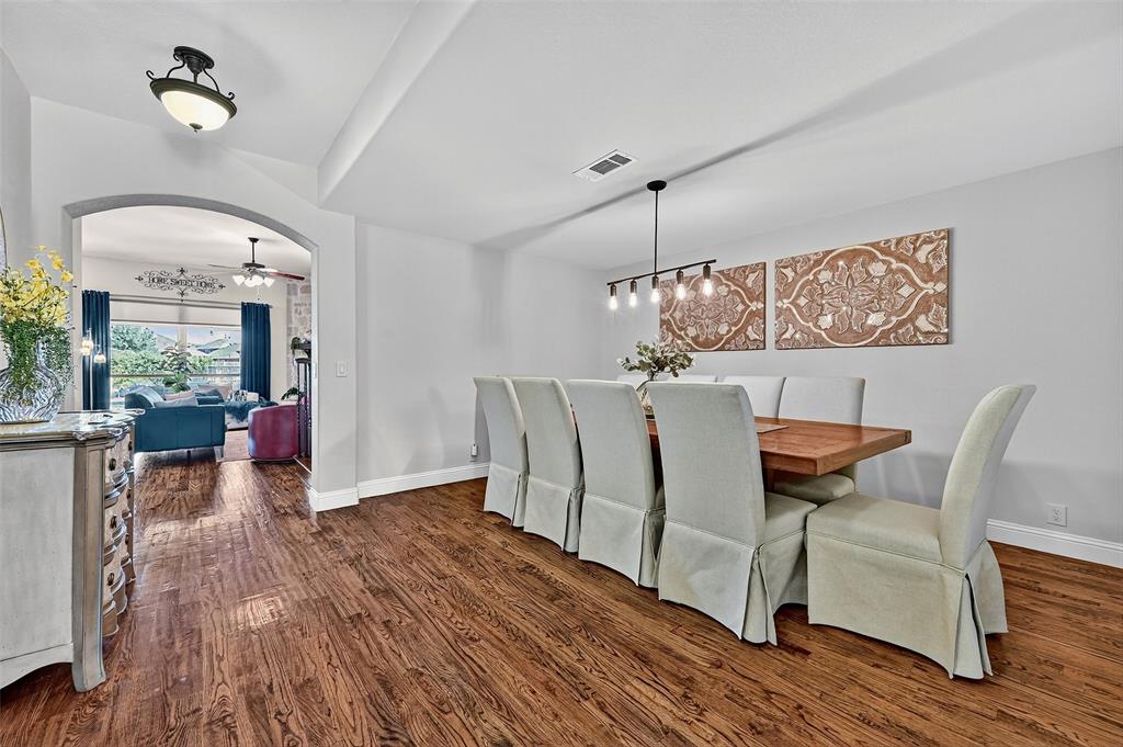 910 Calder Court Anna, TX 75409 - Photo 12 of 37 a living room with furniture and a chandelier