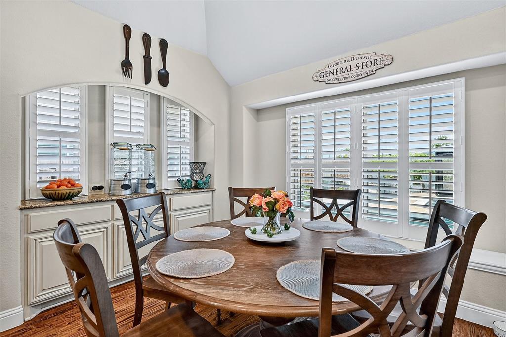 910 Calder Court Anna, TX 75409 - Photo 20 of 37 a dining room with furniture a large window and kitchen view